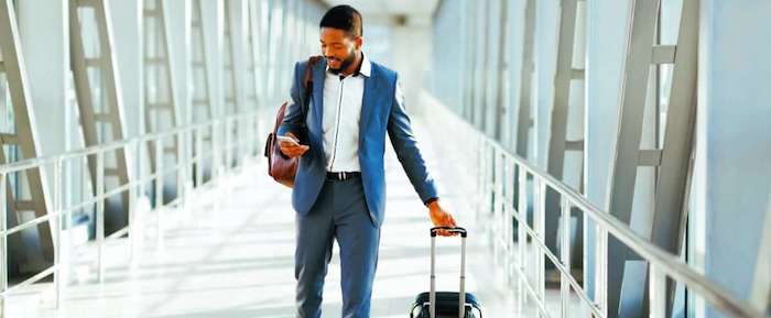 Man with luggage in airport